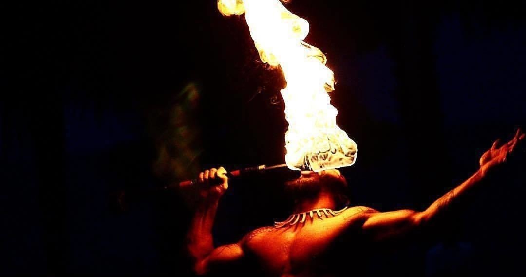 a man that is performing with fire