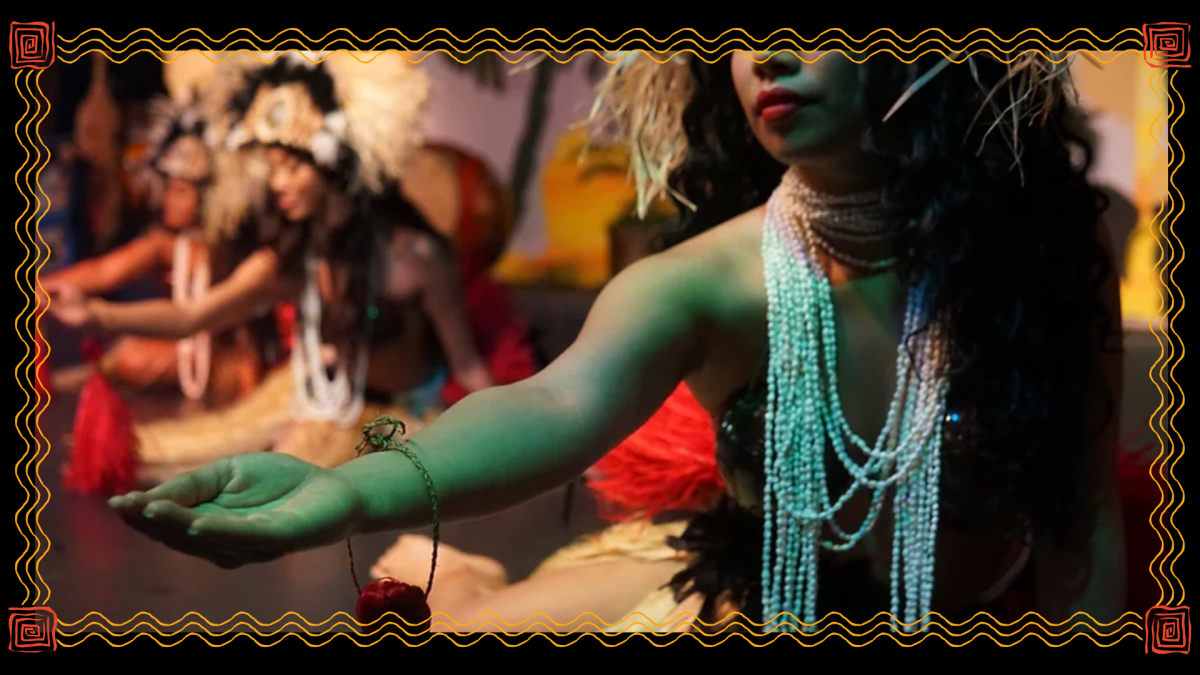 a group of people performing at a luau